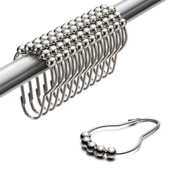 Chrome roller-ball shower curtain rings on a rod, with one ring shown separately