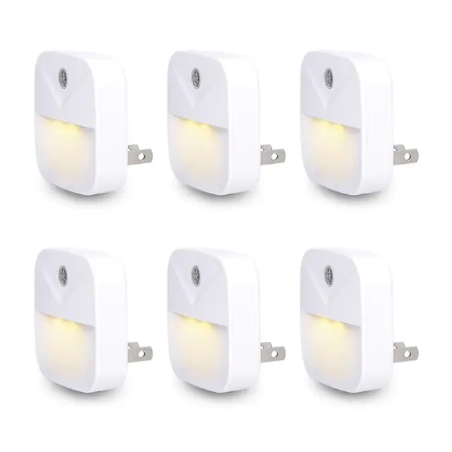 Six plug-in LED night lights shown with warm-white illumination